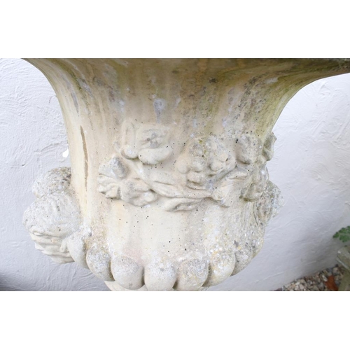274 - Pair of reconstituted stone garden urns of campana form, with relief facial mask decoration and gadr... 