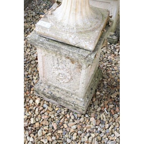 275 - Pair of reconstituted stone garden urns of campana form, with relief facial mask decoration and gadr... 