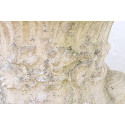 276 - Pair of reconstituted stone garden urns of campana form, with relief facial mask decoration and gadr... 