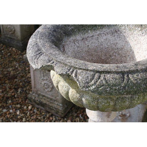 279 - Reconstituted stone garden urn, the bowl of shallow form, raised on a baluster column base. (Measure... 
