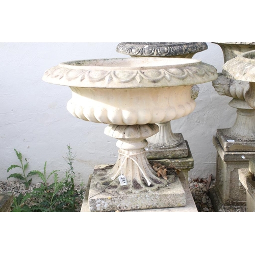 281 - Pair of reconstituted stone garden urns, the bowls of shallow form, with ovolu-moulded rims and gadr... 
