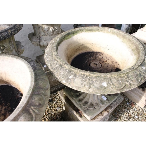 281 - Pair of reconstituted stone garden urns, the bowls of shallow form, with ovolu-moulded rims and gadr... 