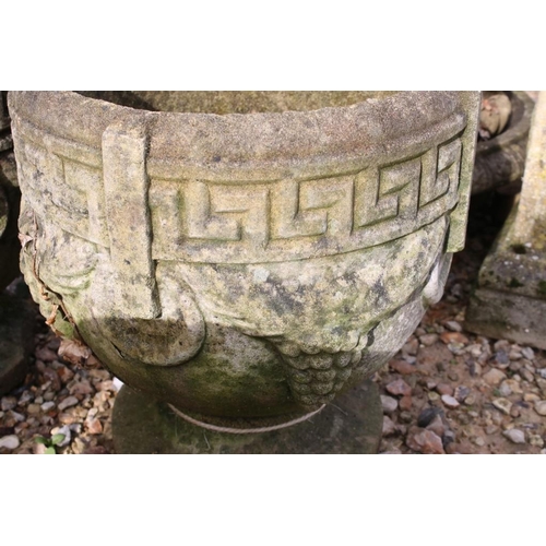 285 - Set of three reconstituted stone planters with Greek key and grape decoration, raised on circular fe... 