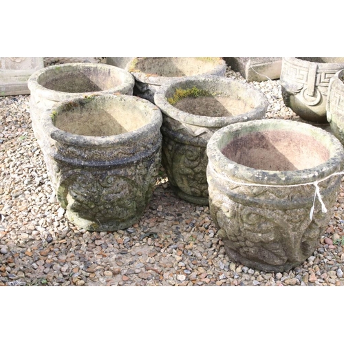 286 - Set of five reconstituted stone garden planters, of circular form with grape and scrolling decoratio... 