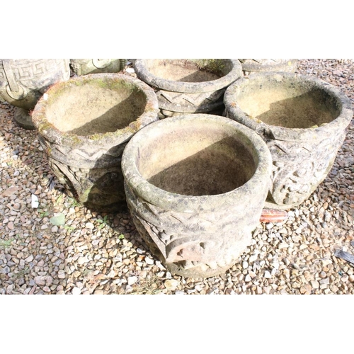 286 - Set of five reconstituted stone garden planters, of circular form with grape and scrolling decoratio... 