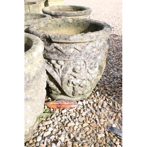 286 - Set of five reconstituted stone garden planters, of circular form with grape and scrolling decoratio... 