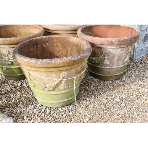 288 - Pair of large terracotta planters, of tapering circular form, with relief garland decoration, each w... 