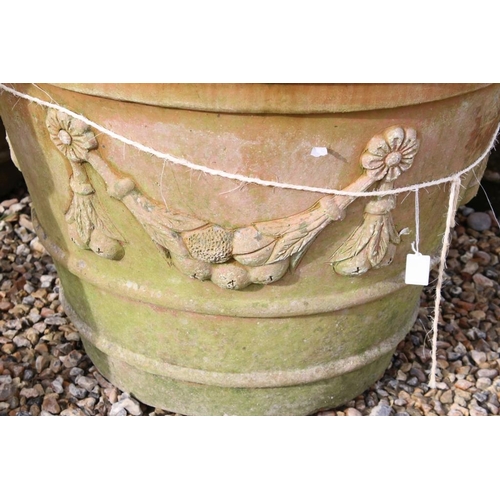 288 - Pair of large terracotta planters, of tapering circular form, with relief garland decoration, each w... 