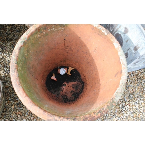 288 - Pair of large terracotta planters, of tapering circular form, with relief garland decoration, each w... 