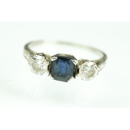 21A - Diamond and sapphire platinum three stone ring, the central truncated rectangular cut sapphire measu... 