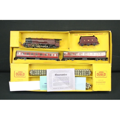 103 - Quantity of Hornby Dublo model railway contained within 4 x boxed sets, include 4 x locomotives feat... 