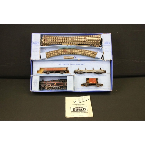 103 - Quantity of Hornby Dublo model railway contained within 4 x boxed sets, include 4 x locomotives feat... 