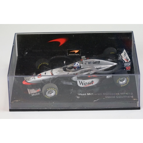 1030 - 15 Boxed / cased F1 related diecast models and helmets to include 4 x cased Heritage Classics, 1/18 ... 