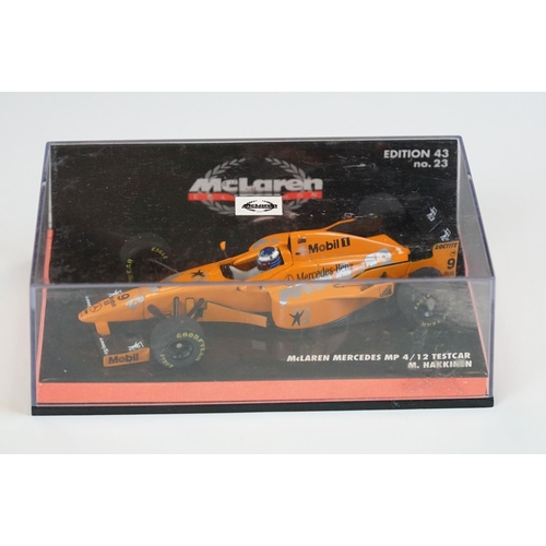 1030 - 15 Boxed / cased F1 related diecast models and helmets to include 4 x cased Heritage Classics, 1/18 ... 