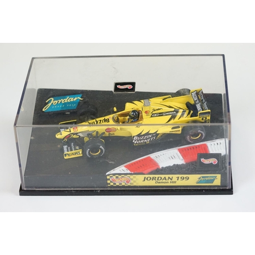 1030 - 15 Boxed / cased F1 related diecast models and helmets to include 4 x cased Heritage Classics, 1/18 ... 