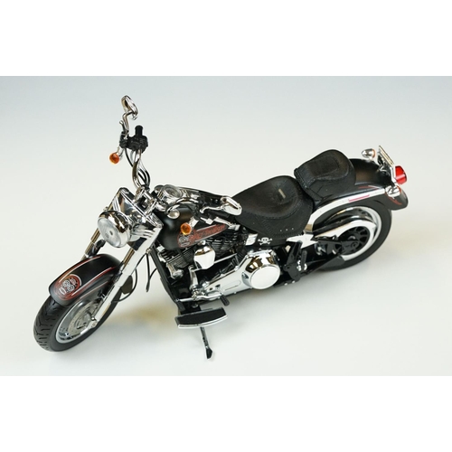 1043 - Two boxed Harley Davidson Diecast Promotions diecast models to include 81146 2011 H-D FLSTC Heritage... 