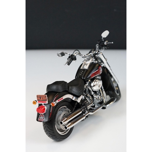 1043 - Two boxed Harley Davidson Diecast Promotions diecast models to include 81146 2011 H-D FLSTC Heritage... 