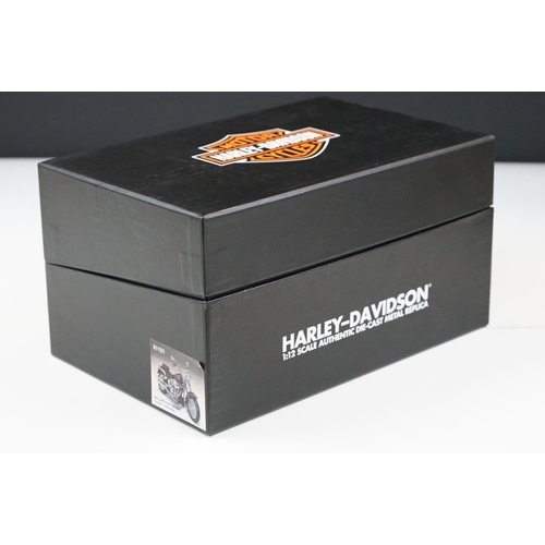 1043 - Two boxed Harley Davidson Diecast Promotions diecast models to include 81146 2011 H-D FLSTC Heritage... 