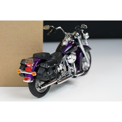 1043 - Two boxed Harley Davidson Diecast Promotions diecast models to include 81146 2011 H-D FLSTC Heritage... 