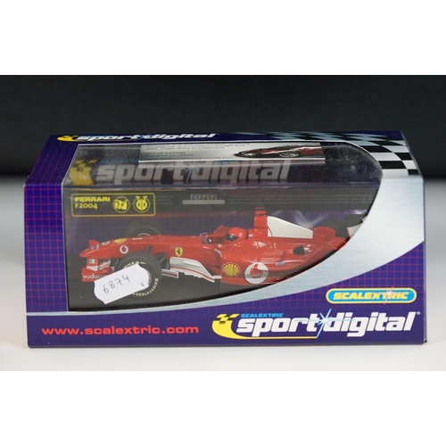 1054 - Three cased / boxed Scalextric Digital F1 slot cars to include C2676D Ferrari F2004 No1, C2715D Hond... 