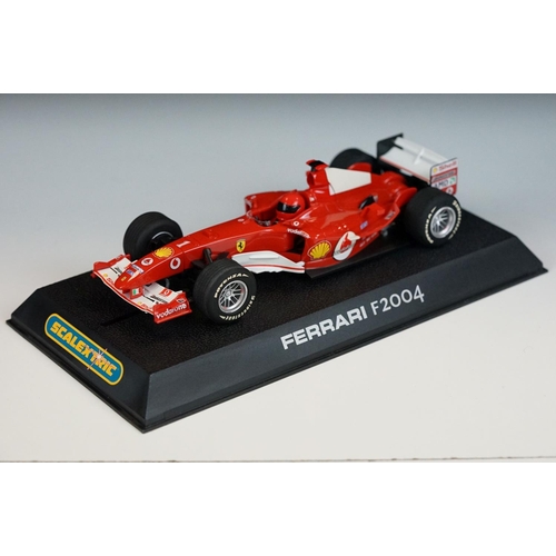 1054 - Three cased / boxed Scalextric Digital F1 slot cars to include C2676D Ferrari F2004 No1, C2715D Hond... 