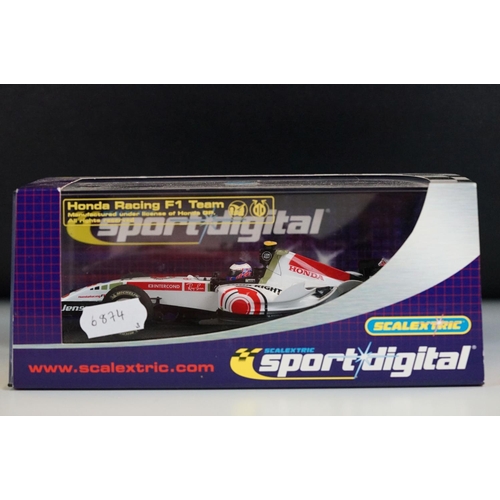 1054 - Three cased / boxed Scalextric Digital F1 slot cars to include C2676D Ferrari F2004 No1, C2715D Hond... 