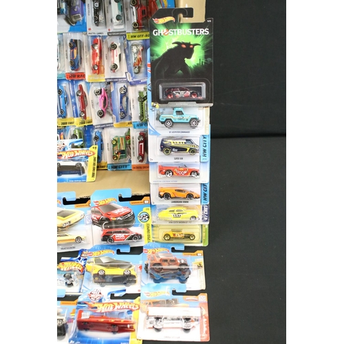 1085 - Around 80 carded Mattel Hot Wheels diecast models, featuring Ghostbusters, HW Race, HW City, 2008 Fi... 