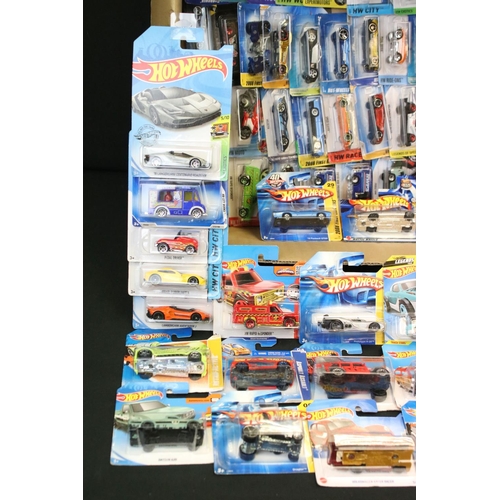 1085 - Around 80 carded Mattel Hot Wheels diecast models, featuring Ghostbusters, HW Race, HW City, 2008 Fi... 