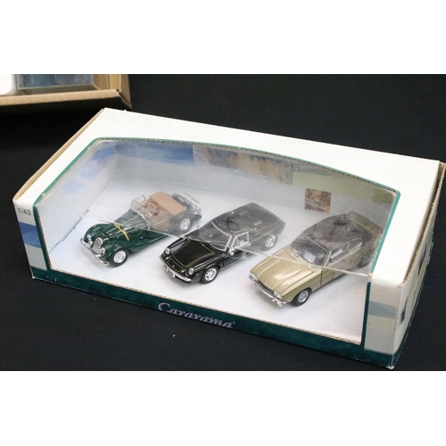 1123 - 27 Boxed / cased diecast models of varying scales to include Corgi, ERTL, Matchbox, Burago, Cararma,... 