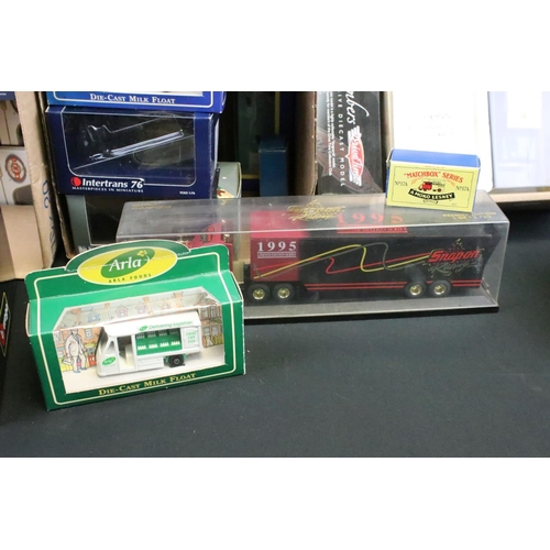 1123 - 27 Boxed / cased diecast models of varying scales to include Corgi, ERTL, Matchbox, Burago, Cararma,... 