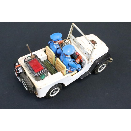 1136 - Four play worn mid 20th C battery-operated tinplate models to include 2 x T.N Nomura of Japan (fire ... 