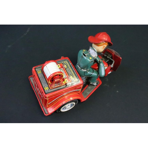 1136 - Four play worn mid 20th C battery-operated tinplate models to include 2 x T.N Nomura of Japan (fire ... 