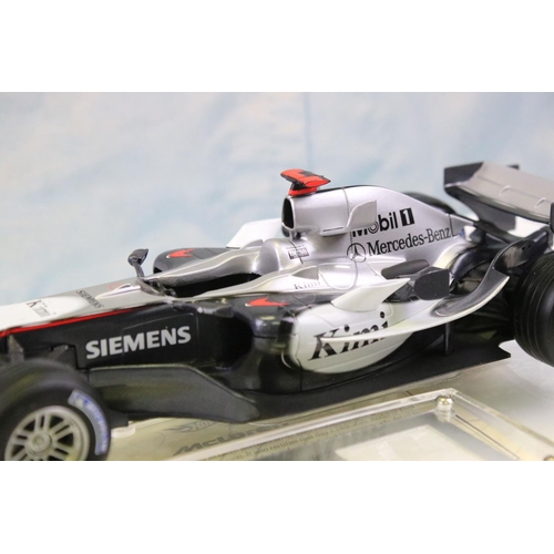 1179 - Three boxed 1/18 F1 diecast models to include 2 x Paul's Model Art Minichamps McLaren Collection (4/... 