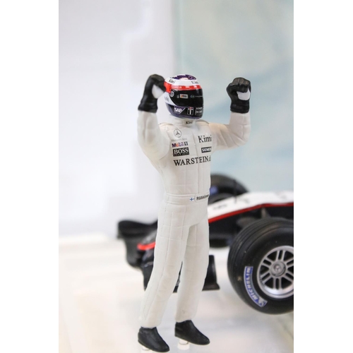 1179 - Three boxed 1/18 F1 diecast models to include 2 x Paul's Model Art Minichamps McLaren Collection (4/... 