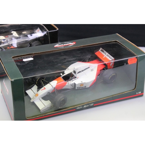 1179 - Three boxed 1/18 F1 diecast models to include 2 x Paul's Model Art Minichamps McLaren Collection (4/... 