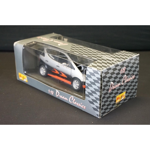 1239 - Nine boxed 1/10 - 1/24 diecast models to include Welly Dodge 02 Ram 1500 Quad Short Box, and 8 x Mai... 