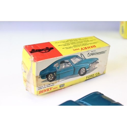 1398 - Four boxed Dinky diecast models to include 136 Vauxhall Viva in metallic blue, 165 Ford Capri with S... 