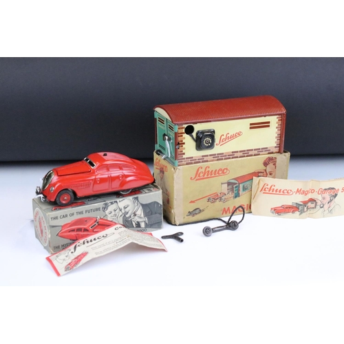 1484 - Boxed Schuco Command Car AD2000 clockwork model in red, with key and paperwork, plus a boxed Schuco ... 