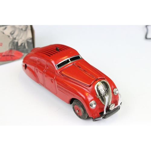 1484 - Boxed Schuco Command Car AD2000 clockwork model in red, with key and paperwork, plus a boxed Schuco ... 