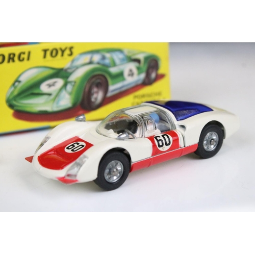 1488 - Two boxed Corgi diecast models to include 330 Porsche Carrera 6 in white with red, race number 30, a... 