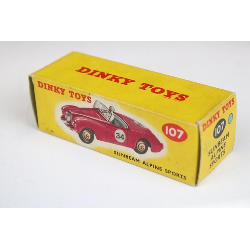 1495 - Three boxed Dinky diecast models to include 107 Sunbeam Alpine Sports in pale blue, 110 Aston Martin... 