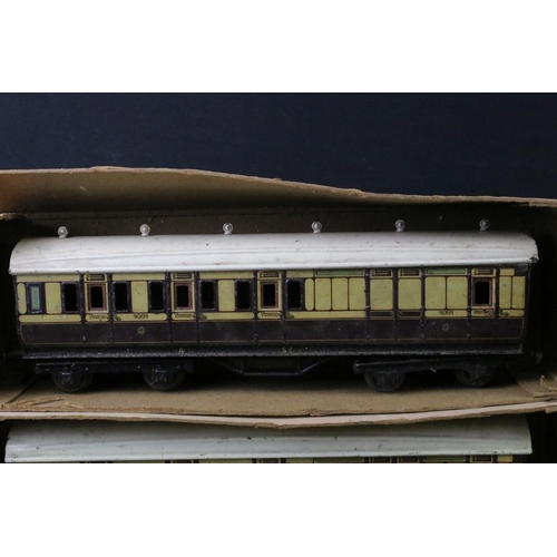 160 - Around 20 early 20th C items of rolling stock to include Bing, Hornby and MLL featuring coaches, wag... 