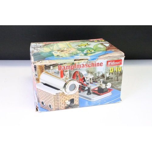 181 - Two Wilesco boxed models - a D 10 stationery steam engine (good, box tatty), and a Dynamo with stree... 