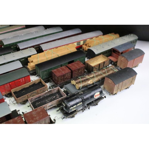 43 - Over 50 OO gauge items of rolling stock to include wagons, coaches and vans featuring mainly kit bui... 