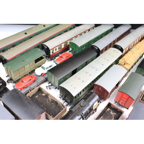 43 - Over 50 OO gauge items of rolling stock to include wagons, coaches and vans featuring mainly kit bui... 