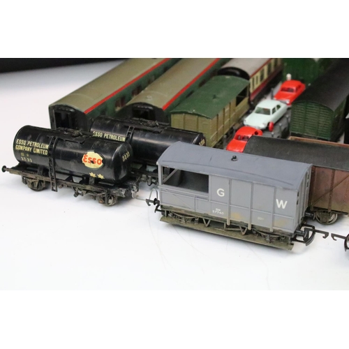 43 - Over 50 OO gauge items of rolling stock to include wagons, coaches and vans featuring mainly kit bui... 