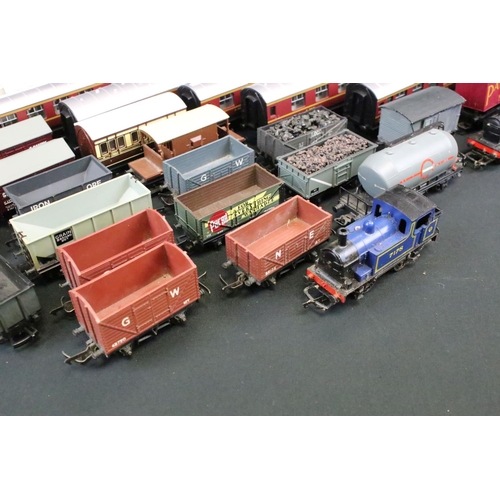 81 - Around 40 OO gauge items of rolling stock to include coaches, wagons and vans featuring Triang, Main... 