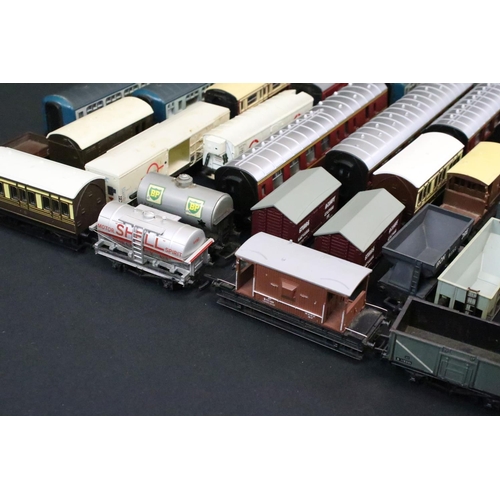 81 - Around 40 OO gauge items of rolling stock to include coaches, wagons and vans featuring Triang, Main... 