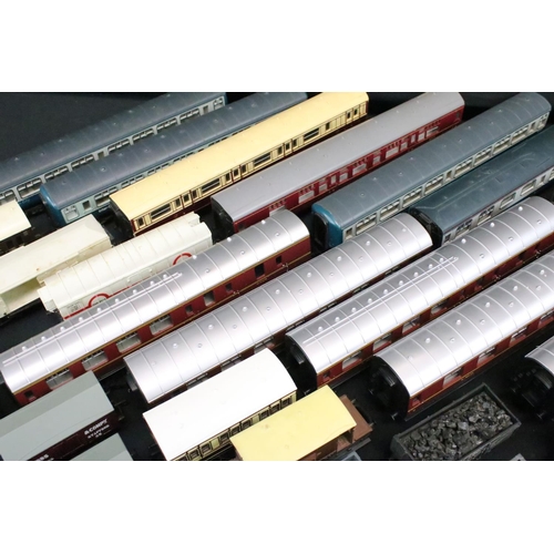 81 - Around 40 OO gauge items of rolling stock to include coaches, wagons and vans featuring Triang, Main... 