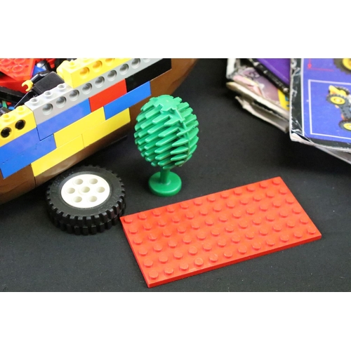 377 - Lego - A large quantity of various Lego bricks and accessories, featuring mini figures, a part-built... 